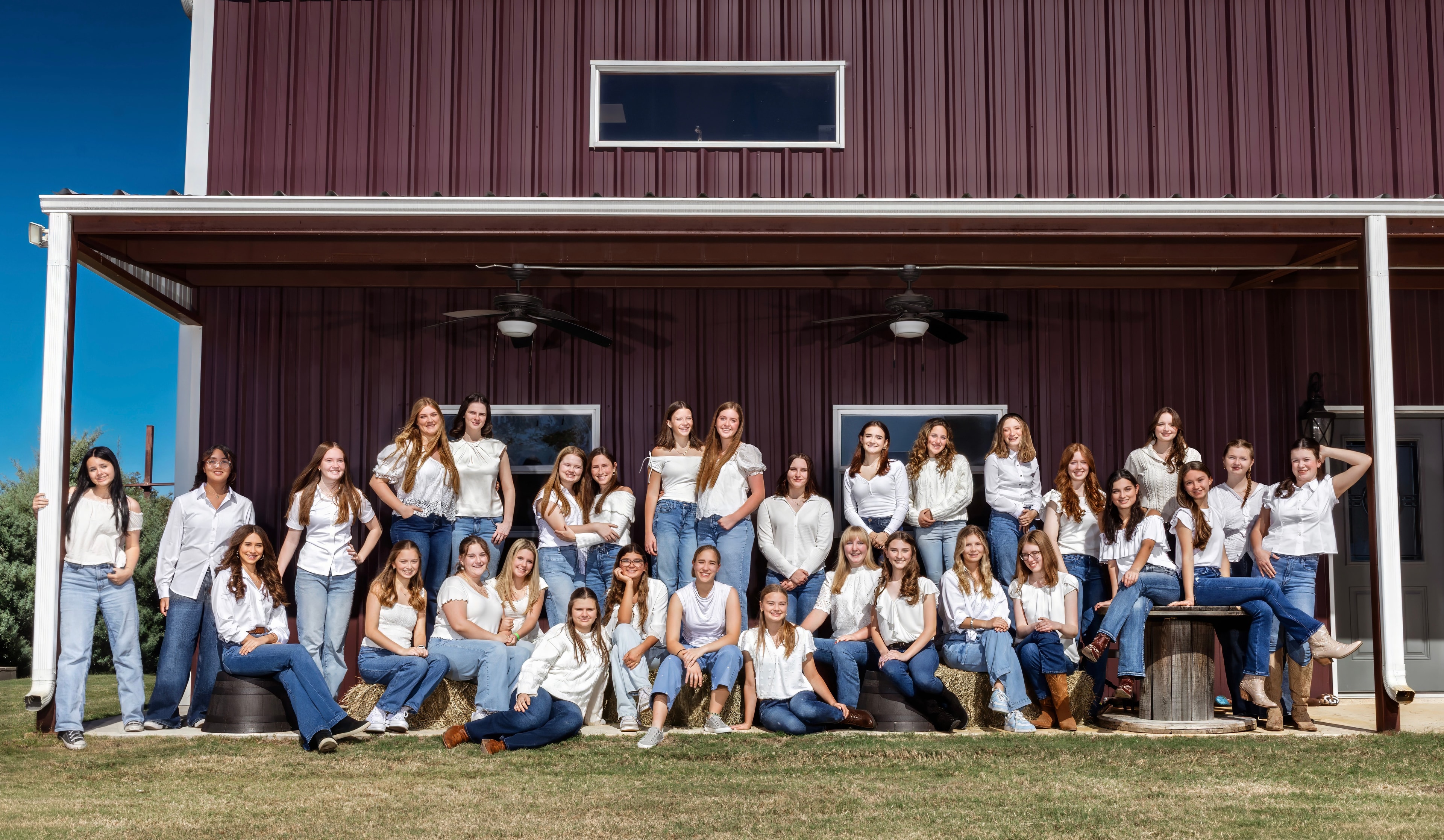 Aledo Choir students posed together outside a barn